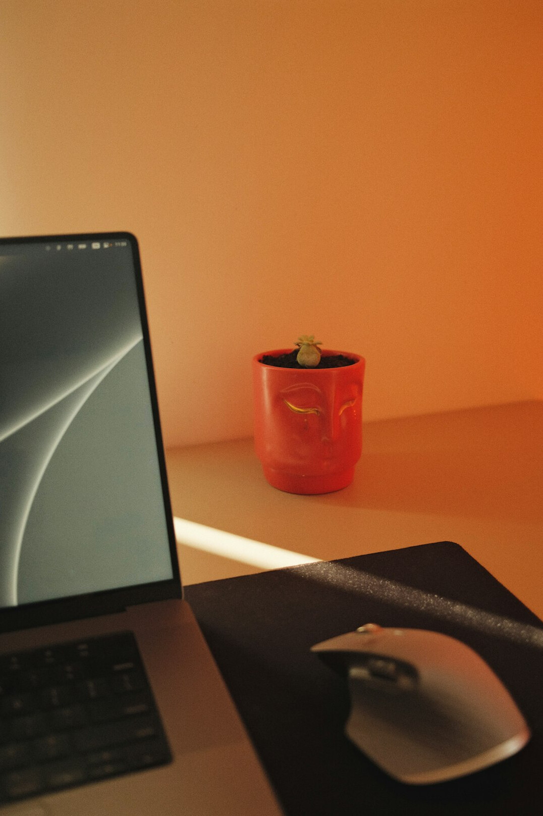 Close-up of financial growth charts and a laptop on a desk